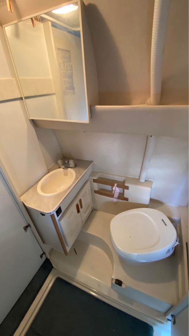 Full bathroom with toilet, sink, and shower in Leisure Travel Widebody
