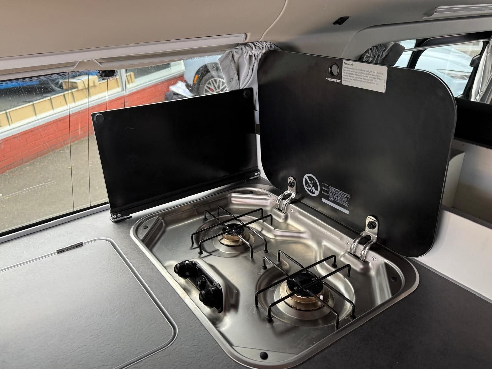 Dual-burner gas hob in the 2025 Next-Gen Nugget pop-top campervan kitchen