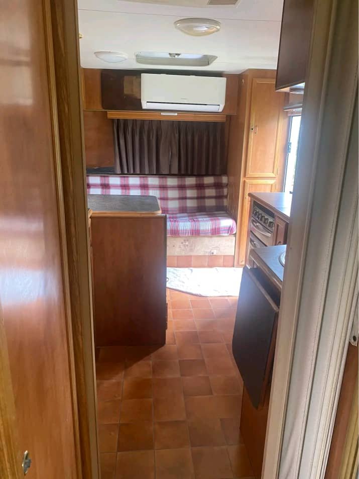 Front dinette seating area in Regent caravan