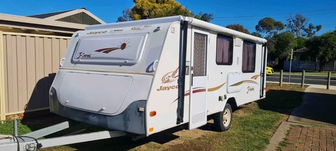 Front exterior view of caravan showing drawbar, tongue, and hitch