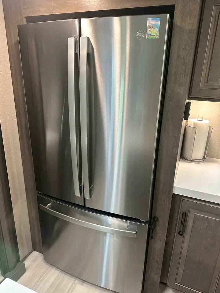 GE residential refrigerator with ice maker and water dispenser