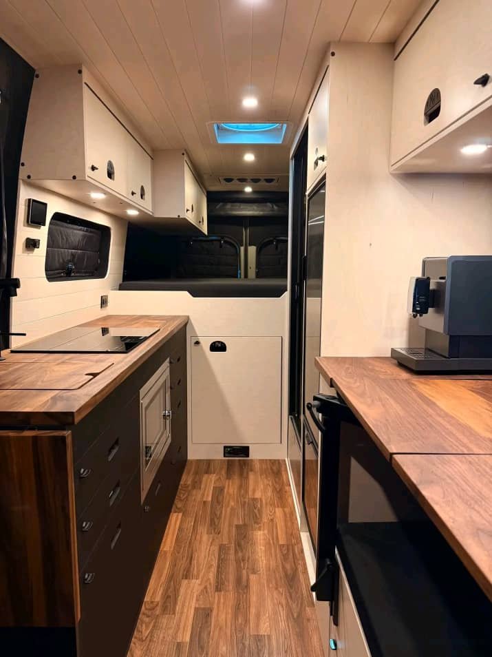 Induction cooktop inside Sprinter van kitchen