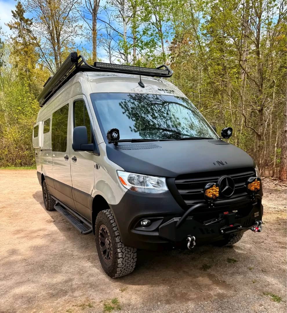 Left side exterior view of the 2024 Mercedes-Benz Sprinter 2500 passenger van in black.
