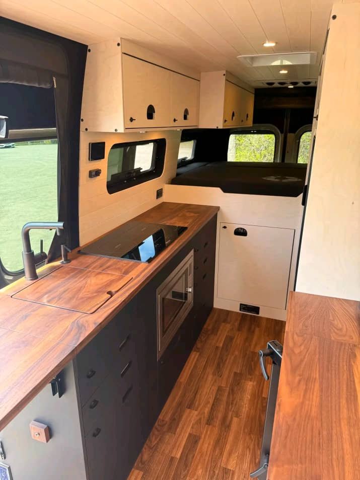 Premium handcrafted cabinetry inside Sprinter camper