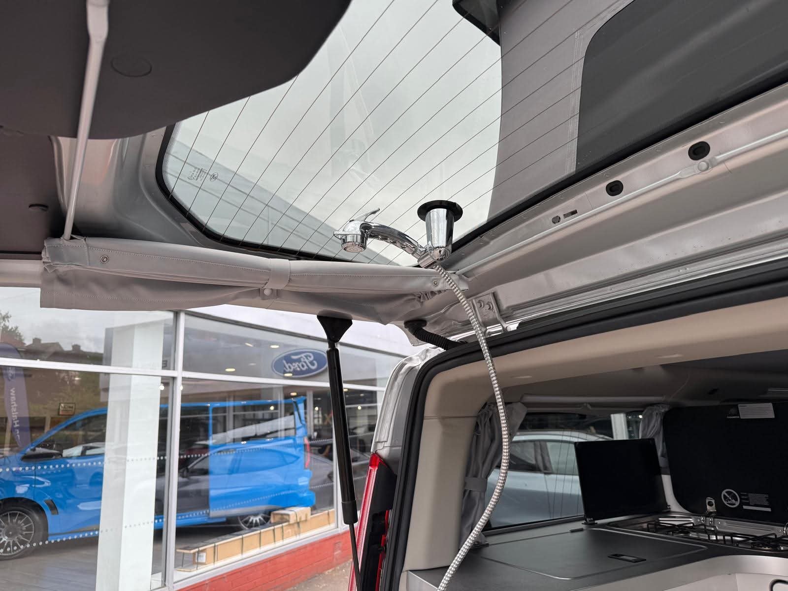 Rear bench converted to a double bed in the 2025 Next-Gen Nugget campervan