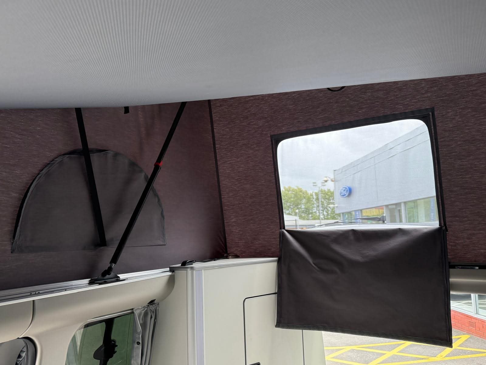 Rear view of the 2025 Next-Gen Nugget with pop-top and rear extensions visible