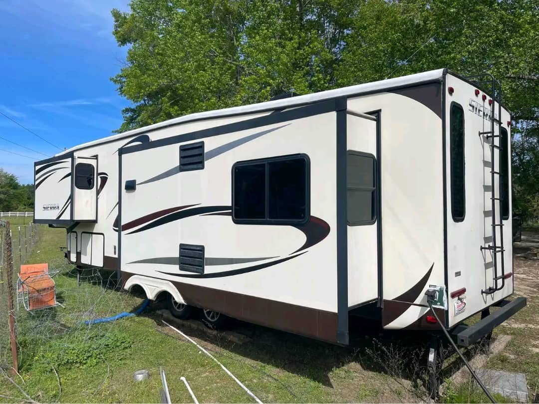 Side exterior view of motorhome with tinted windows