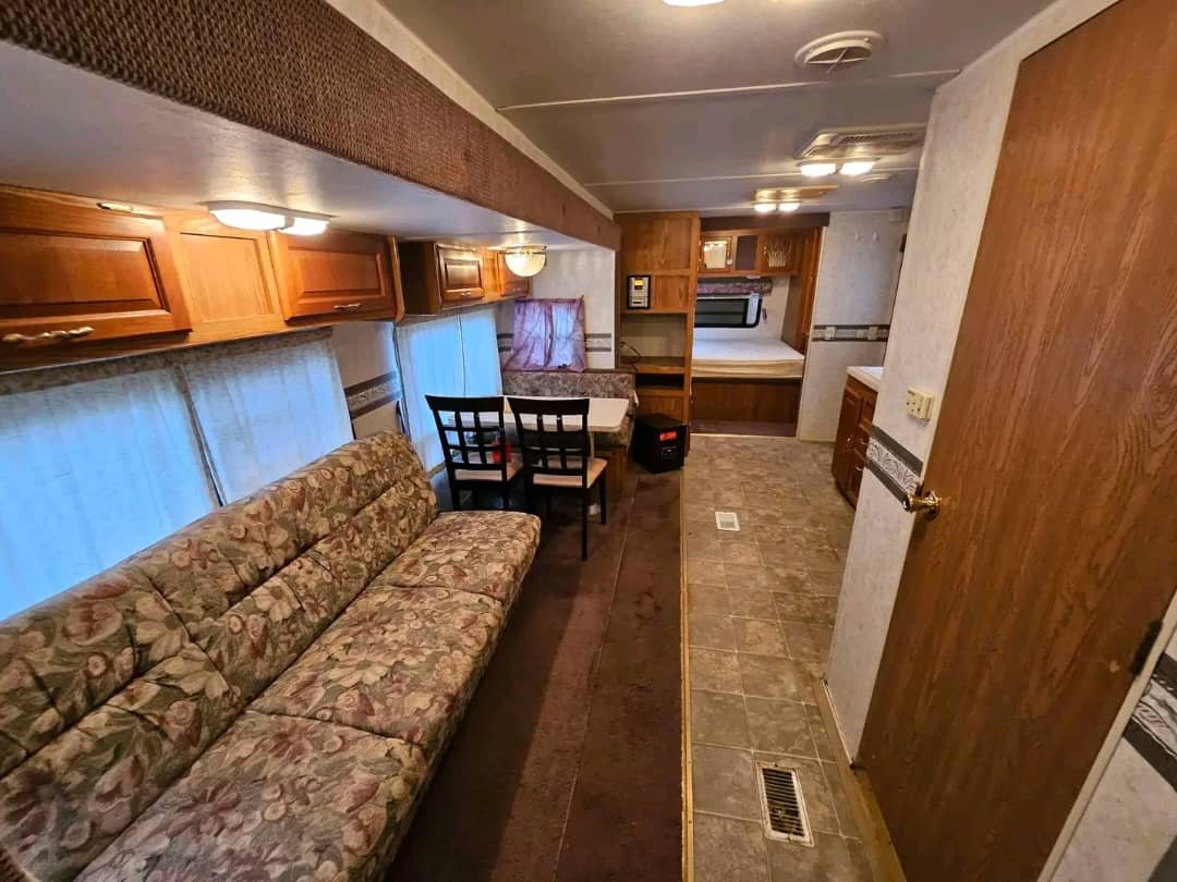 RV sofa seating in the Forest River Wildwood 2BR bunkhouse.