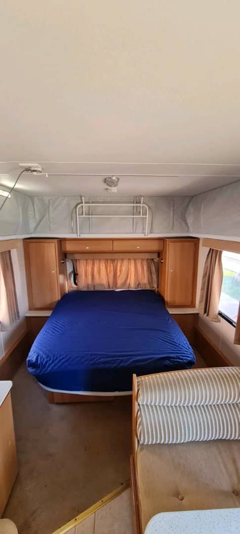 Sleeping beds in the raised poptop area of the Jayco J Series Caravan