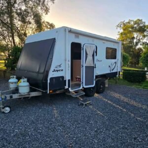 Left side exterior view of 2012 Jayco J Series Caravan with awning extended