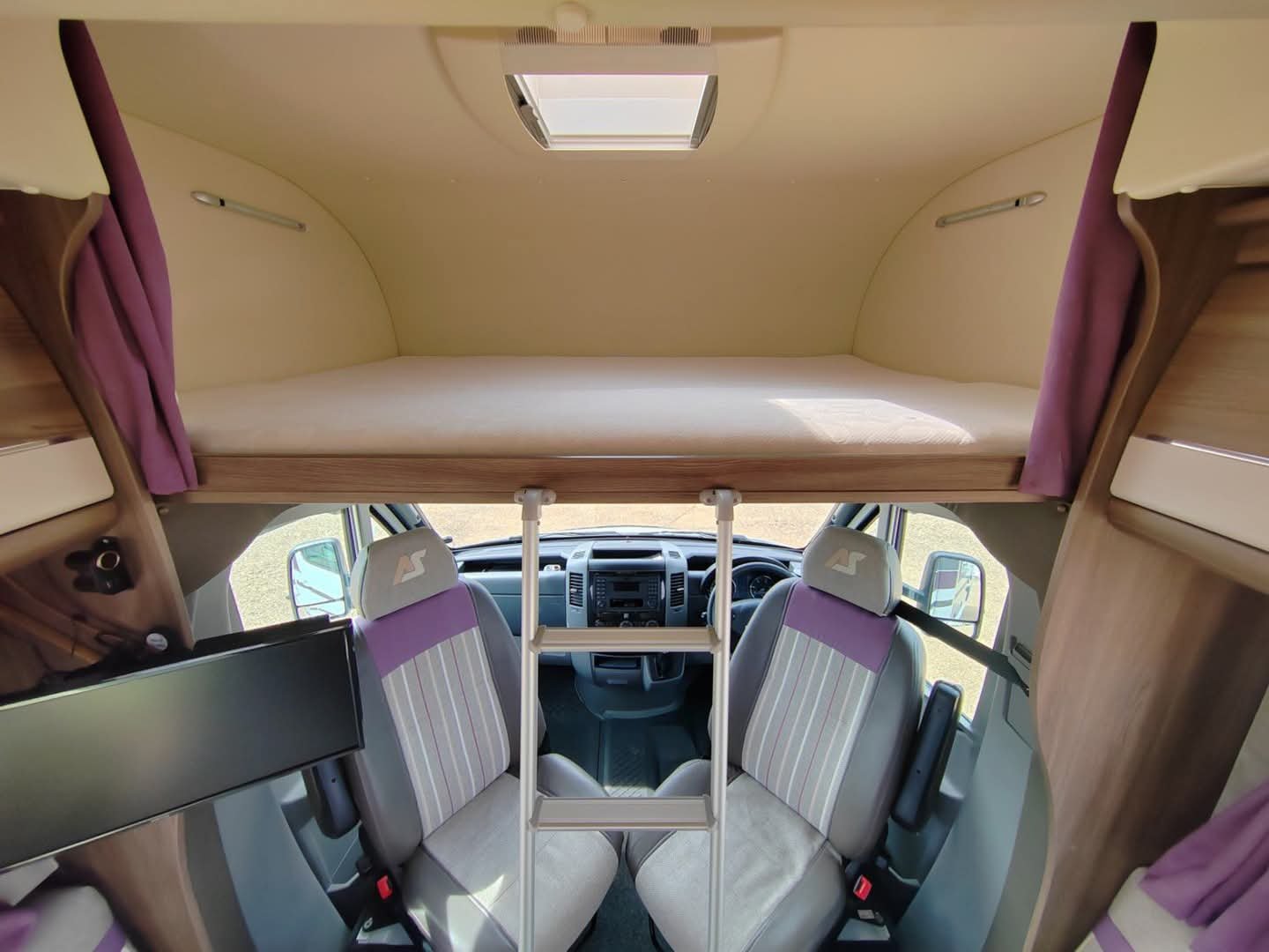 Overhead storage closets in Unity 24TB motorhome