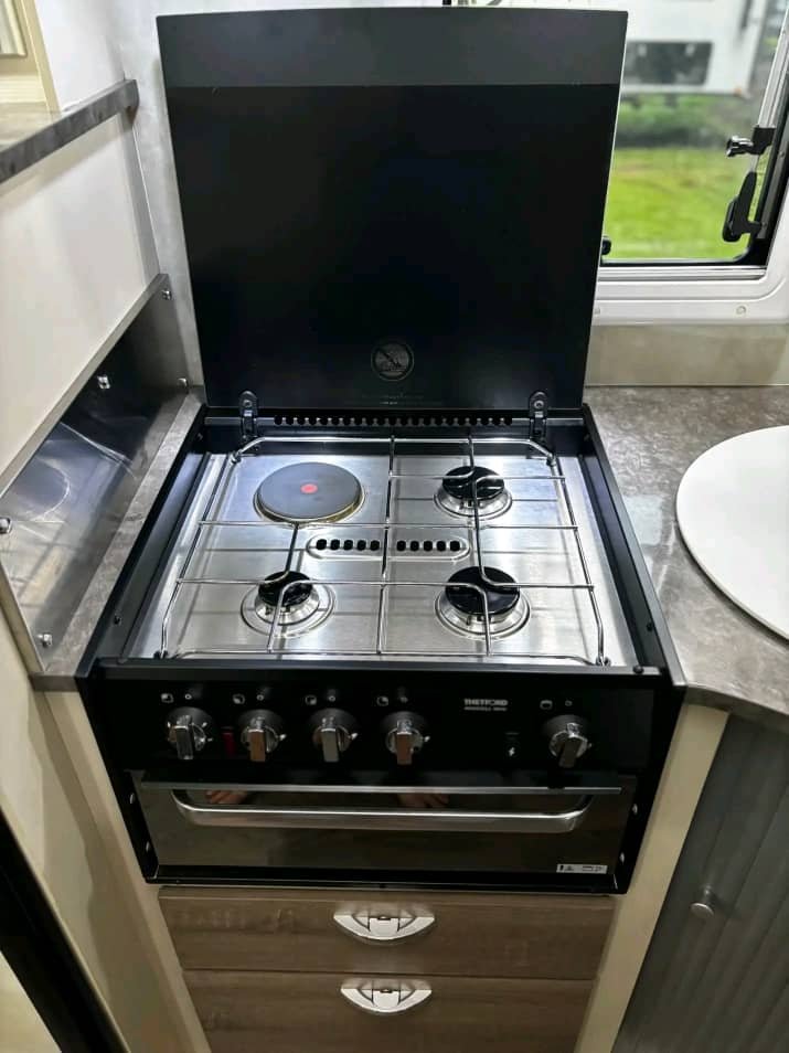 Four burner cooker inside Jergens Skygazer caravan