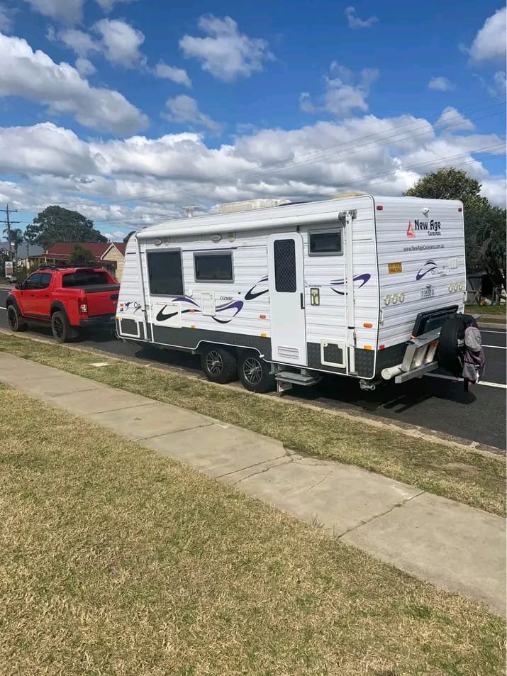 Angled rear view of 2014 New Age semi off-road caravan