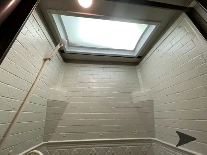 Walk-in shower bathroom in Grand Design Imagine XLS travel trailer