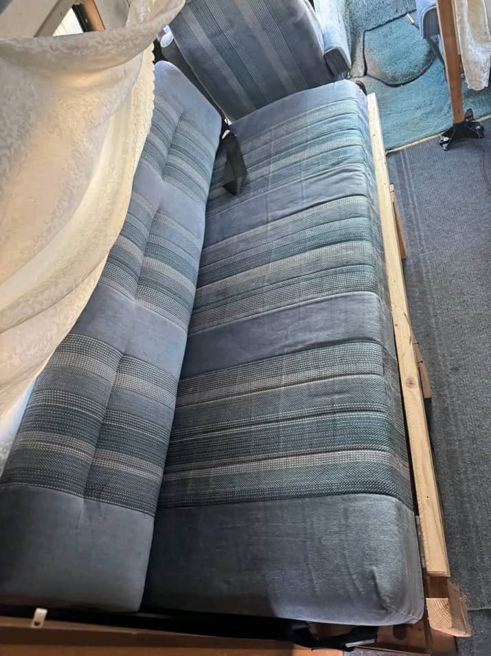 Bed and couch conversion in 1990 Ford Econoline camper van
