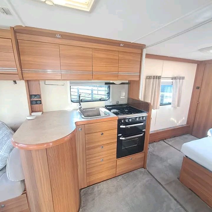 Dinette seating and kitchen area in Elddis Buccaneer Clipper caravan