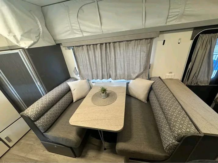 Dinette seating area in Jayco Journey Outback pop-top caravan