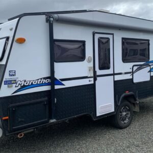 couples rv trailer Door side exterior view of Olympic Kingfisher Marathon caravan