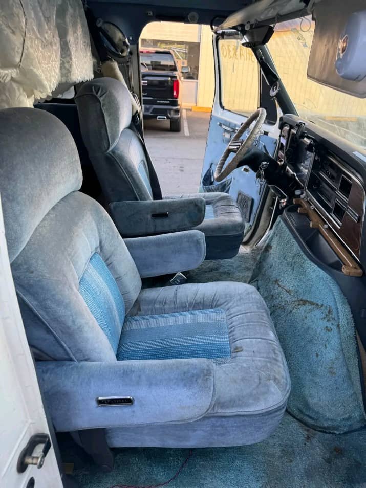 Driver cockpit area of 1990 Ford Econoline camper
