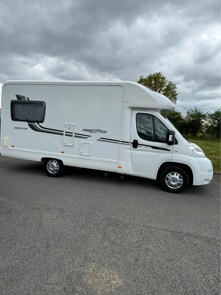 Full side profile of 2011 compact 2-berth motorhome