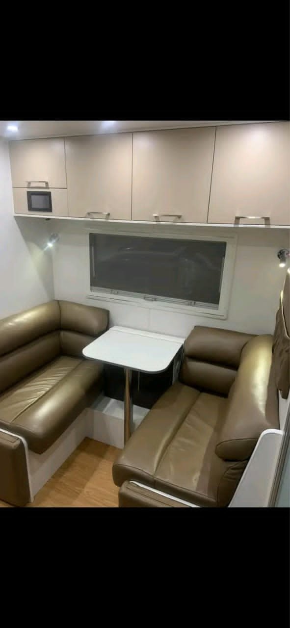 Leather café dinette seating in New Age caravan