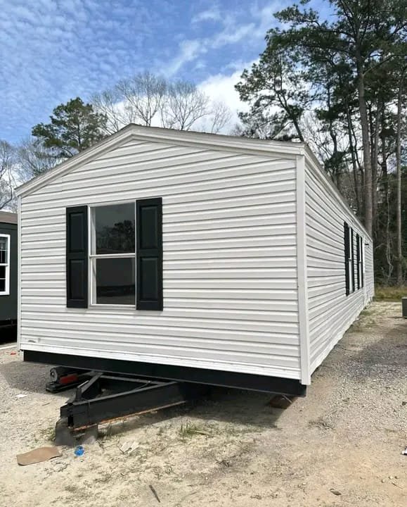 Left angled front exterior view of single wide manufactured home