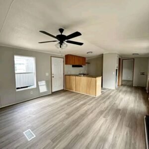 single wide manufactured home prices​ Living room with ceiling fan ventilation in single wide manufactured home