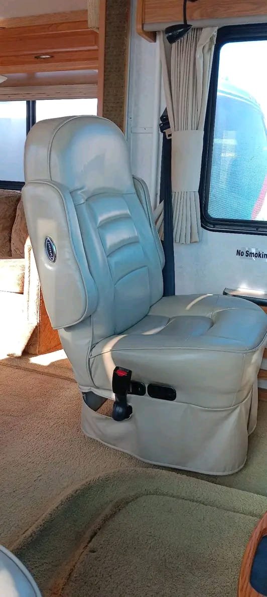 Passenger seat with seatbelt in Class A motorhome