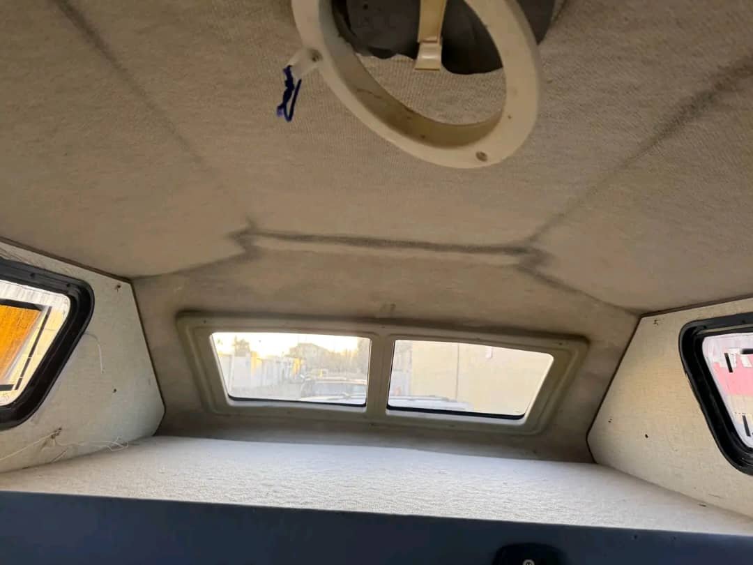 Pop-up bed inside Ford Econoline camper van