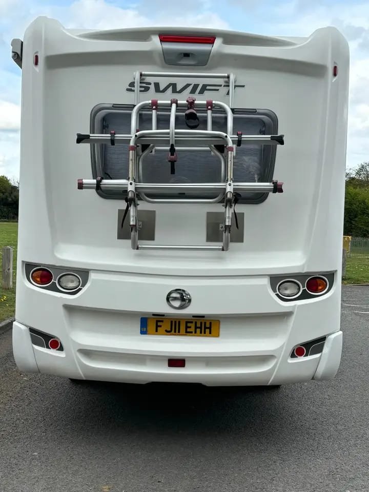 Rear exterior view of 2011 motorhome with bike rack