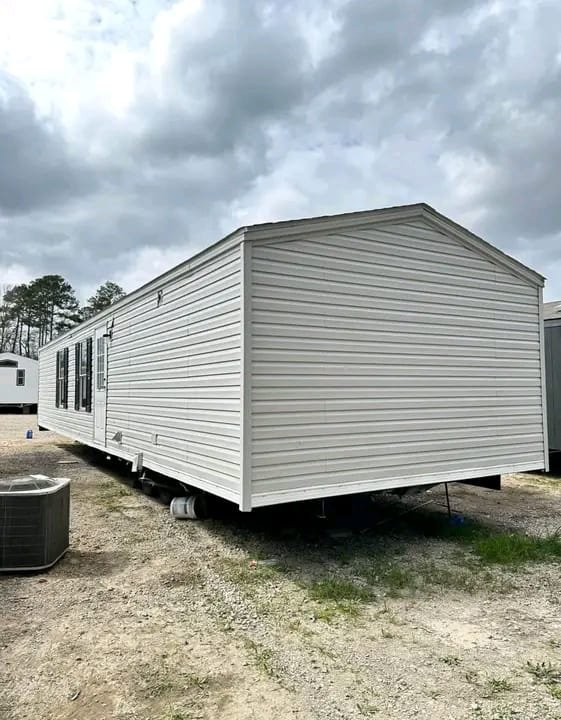Rear exterior view of single wide manufactured home