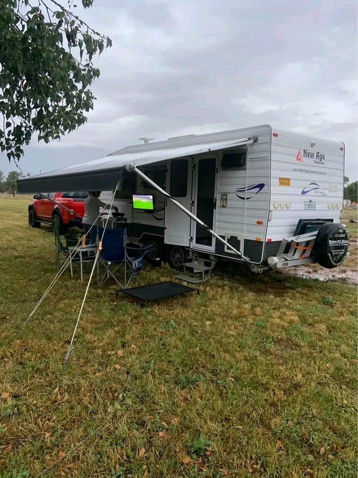 Rear view of New Age caravan with external hookups