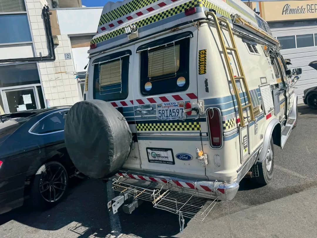 Rear view with spare tire on Ford Econoline camper