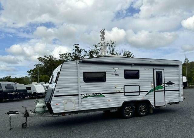 Non-door side profile of Olympic Kingfisher Marathon caravan
