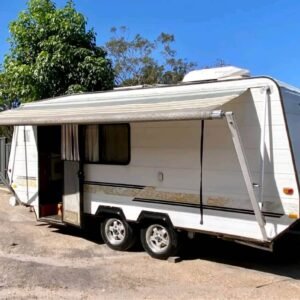 Side profile of Viscount Seabreeze caravan with awning and portable shower caravan​
