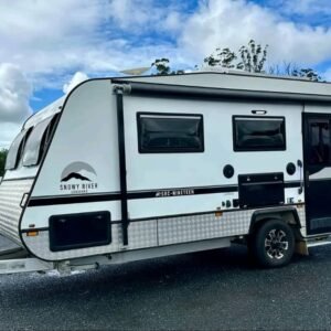 Side profile of Snowy River SRC-19 caravan with awning deployed in snowy river rv park