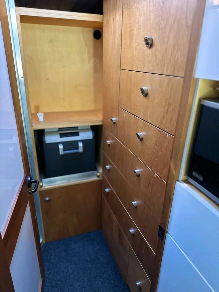 Wardrobe and storage cabinets inside Mitsubishi Rosa motorhome