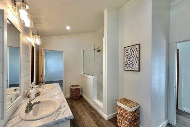 Mosaic tile shower in manufactured home bathroom